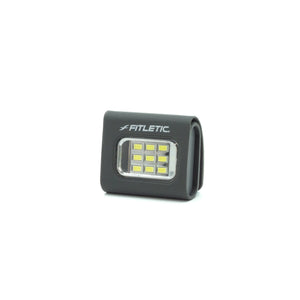 Lumo Clip LED Light attached to vest